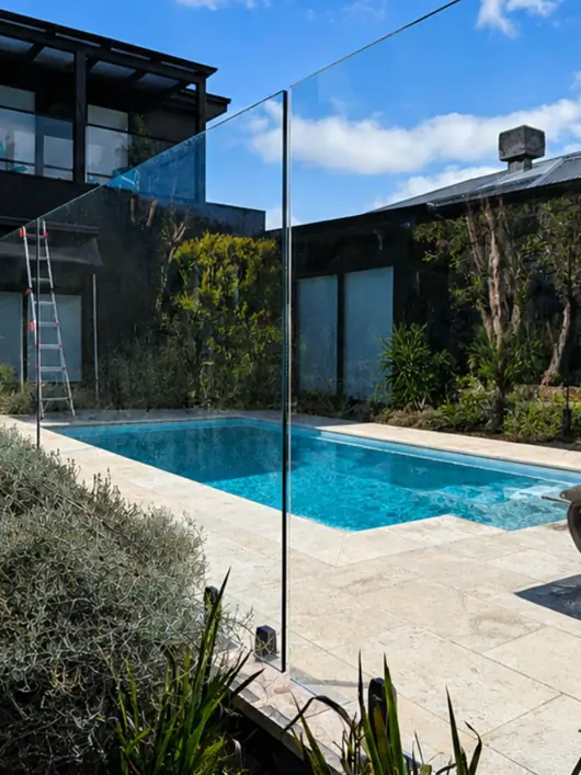 Glass pool fence after cleaning, the pool and garden clear through the glass
